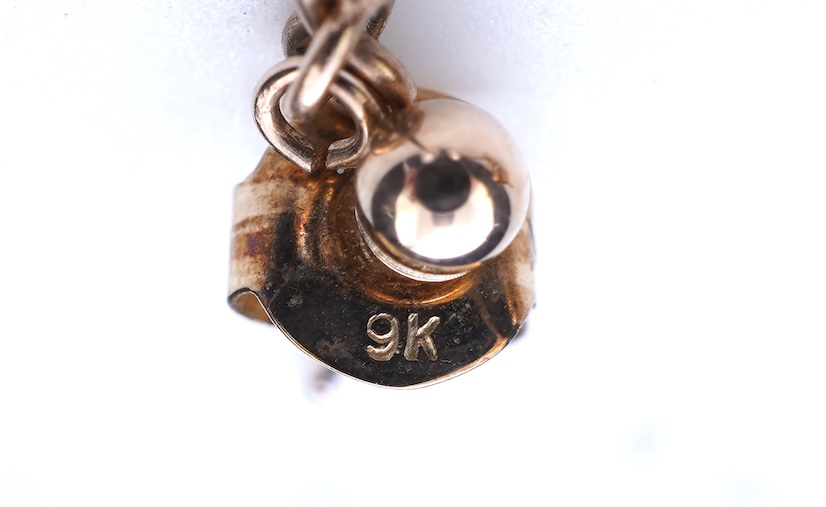 A group of cultured pearl jewels, comprising: two pairs of cultured pearl drop earrings, longest 3cm, mounted in gold; and two cultured pearl brooches mounted in 9ct gold, longest 4.1cm, British hallmarks, combined gross